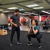 Personal training with man and woman in our Houston gym