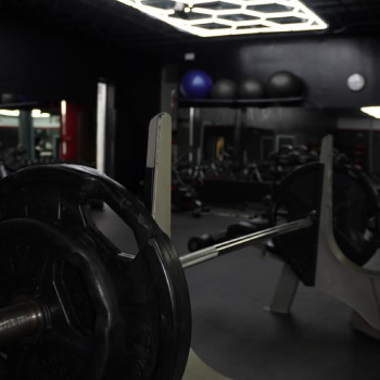 Picture of a barbell on a bench press machine